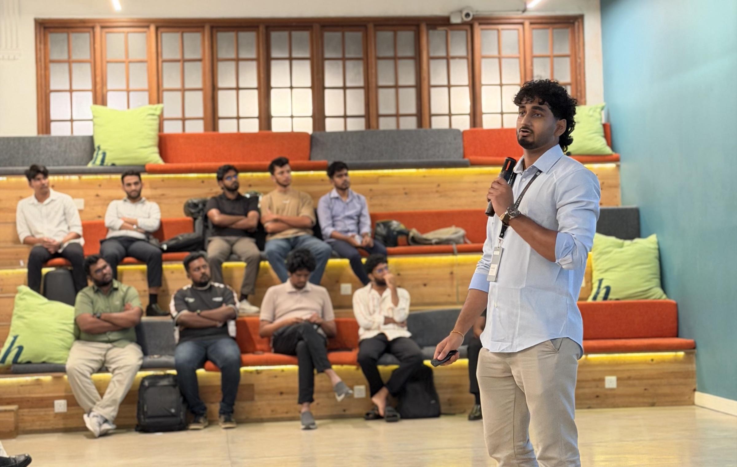 Chamidu speaking to a seated audience at the AAIF Sri Lanka Chapter meetup